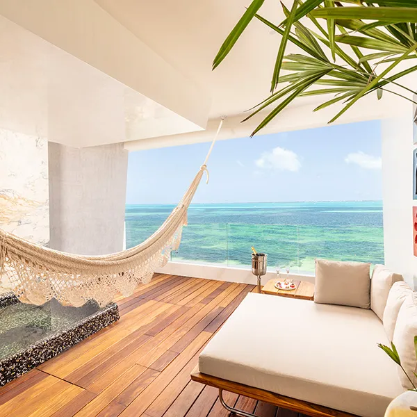 Mousai suite bedroom with two beds and ocean views at Hotel Mousai Cancun Mousai suite bedroom with two beds and ocean views at Hotel Mousai Cancun